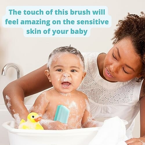 Parent bathing baby with brush and rubber duck.