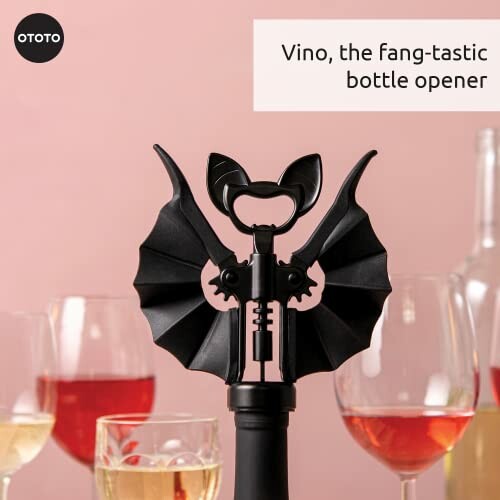 Bat-wing shaped bottle opener with glasses of wine.