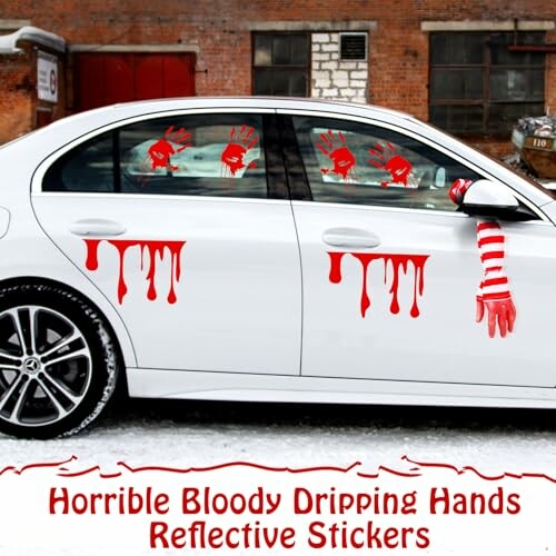 Car with red bloody handprint stickers on windows and doors.