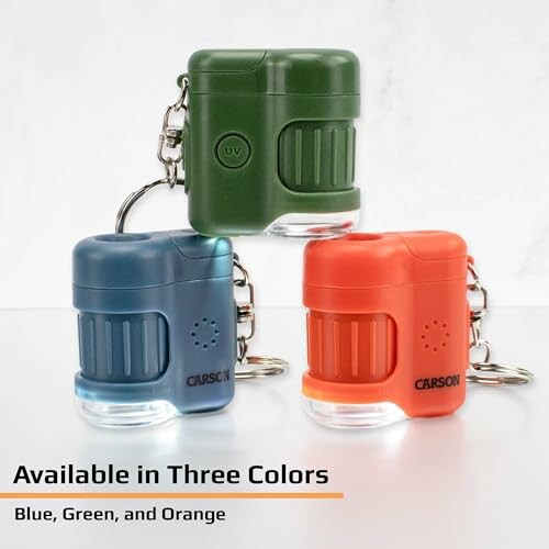 Three pocket microscopes in blue, green, and orange.