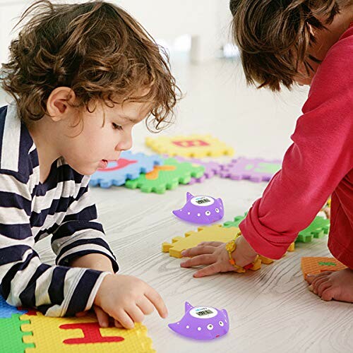 Children playing on colorful foam mats with small toys.