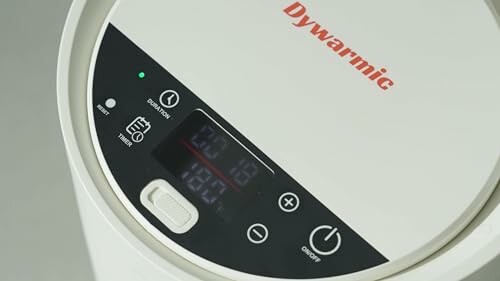 Close-up view of Dywarmic dehumidifier control panel with digital display and buttons.