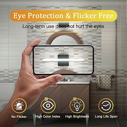 Hand holding phone displaying light with eye protection and flicker-free features.