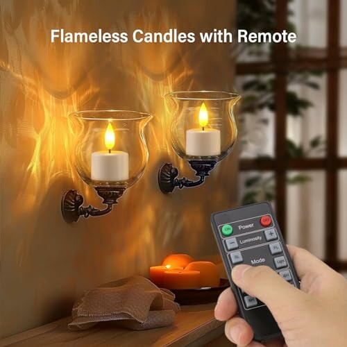 Flameless candles with remote control on a wall.
