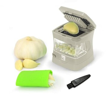 Garlic chopper set with garlic bulb, cloves, green peeler, and black brush.