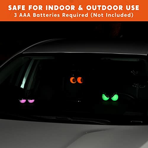 Car windshield with glowing eyes decoration for indoor and outdoor use.