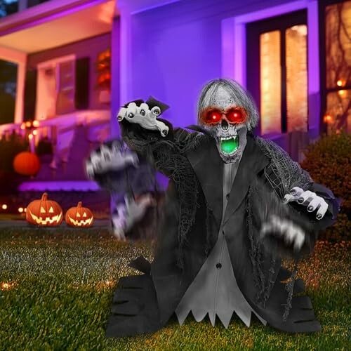 Creepy Halloween lawn decoration with glowing eyes and pumpkins