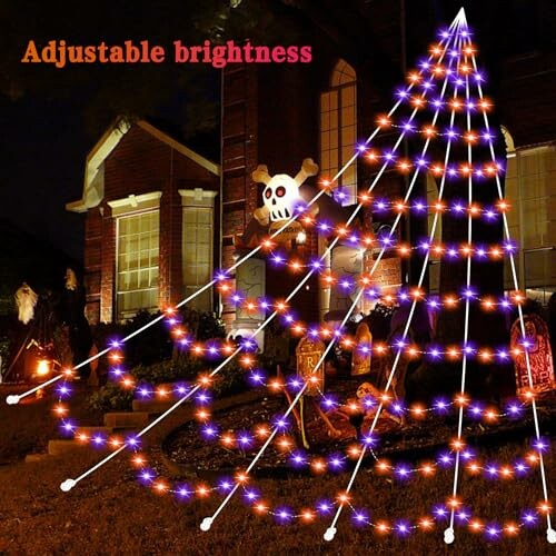 Halloween-themed light tree with skull and house in background.