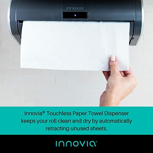 Hand using Innovia touchless paper towel dispenser