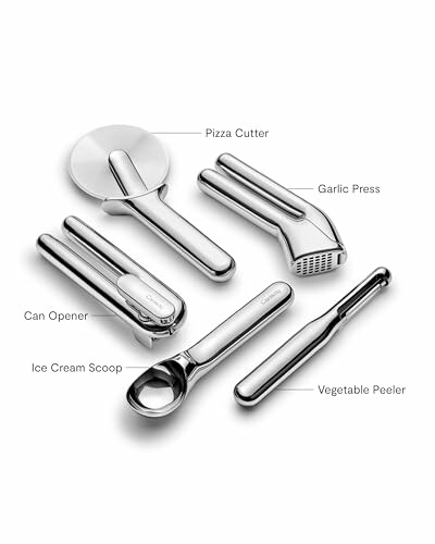 Set of stainless steel kitchen tools including pizza cutter, garlic press, can opener, ice cream scoop, and vegetable peeler.