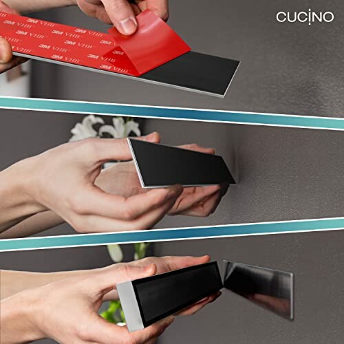 Hands installing magnetic adhesive strip on a wall surface.