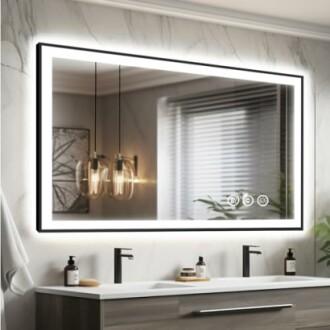 Modern bathroom with a large illuminated mirror, double sink, and hanging lights.