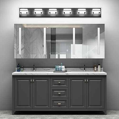 Modern bathroom with double sink vanity and large mirror.