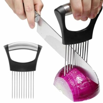 Onion slicing tool with handle and prongs in use