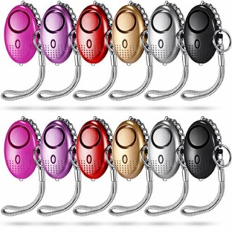 Set of colorful personal safety alarms with keychains.