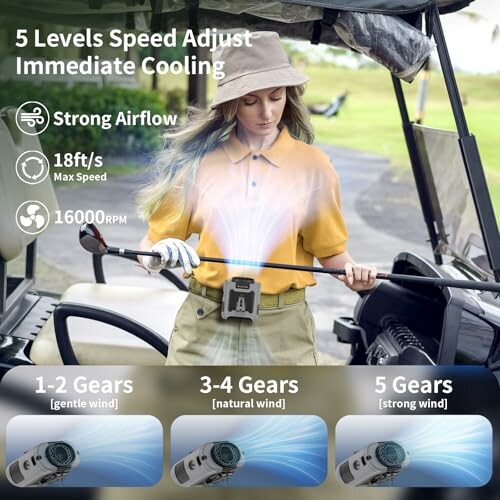 Person using a portable fan with adjustable speeds in a golf cart.