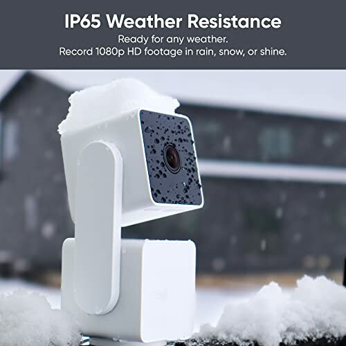 Outdoor security camera with IP65 weather resistance covered in snow.
