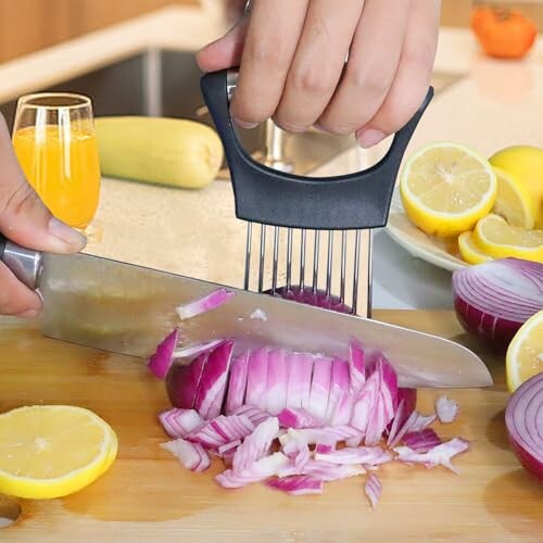 Person using kitchen tool to slice a red onion on a cutting board.