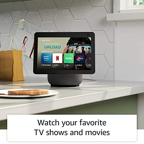 Smart display on kitchen counter showing streaming services like Prime Video, Netflix, Hulu, and Apple TV.