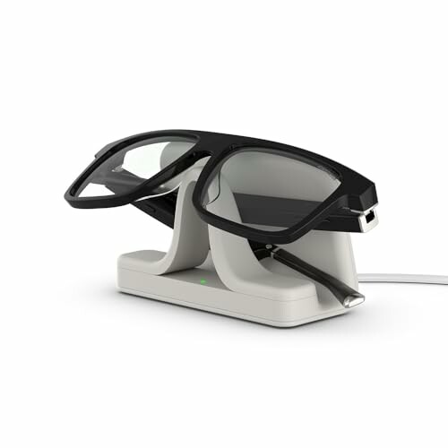 Smart glasses resting on a charging stand.