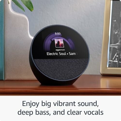 Smart speaker with display showing music playback on a desk