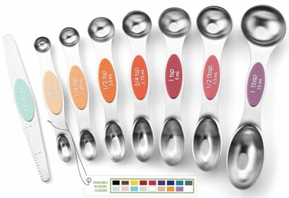 Set of stainless steel measuring spoons with colorful labels.