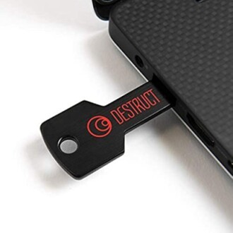USB drive labeled 'Destruct' inserted into a laptop.