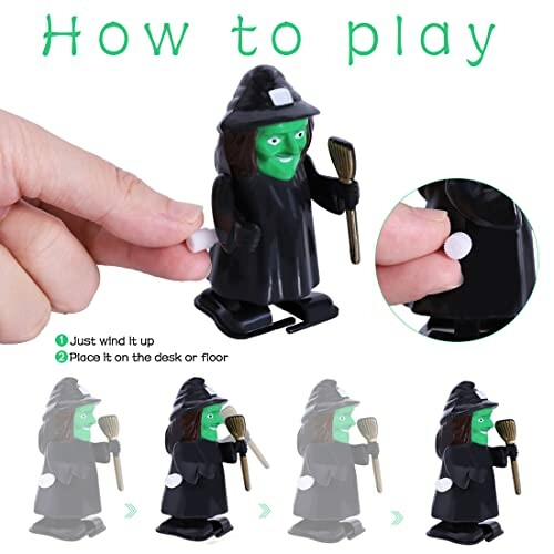 Hand winding up a small witch toy with instructions.