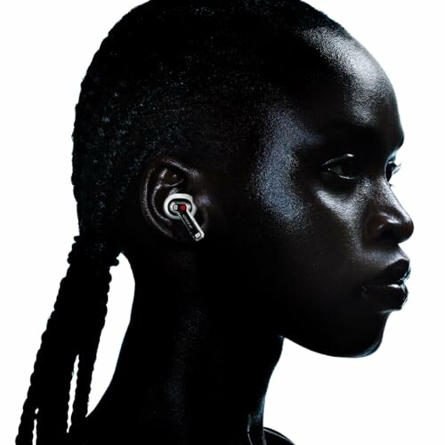Profile view of person wearing wireless earbud